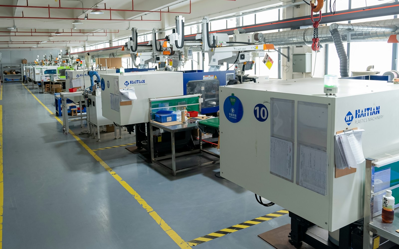 Injection moulding machines on a factory floor
